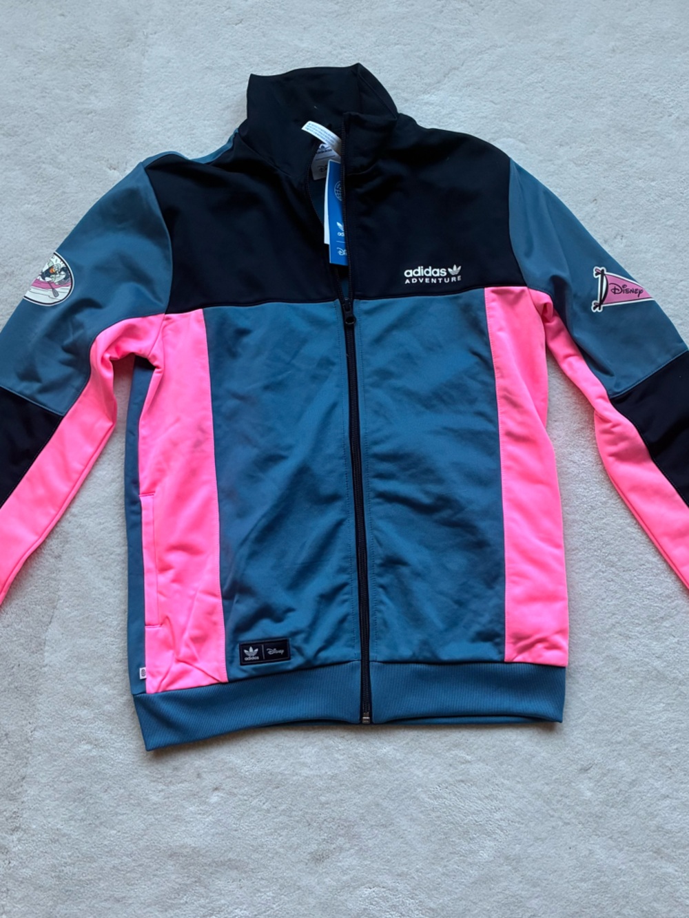 This is an extra RARE LIMITED EDITION DISNEY /ADIDAS Puffer-Style Track Jacket
